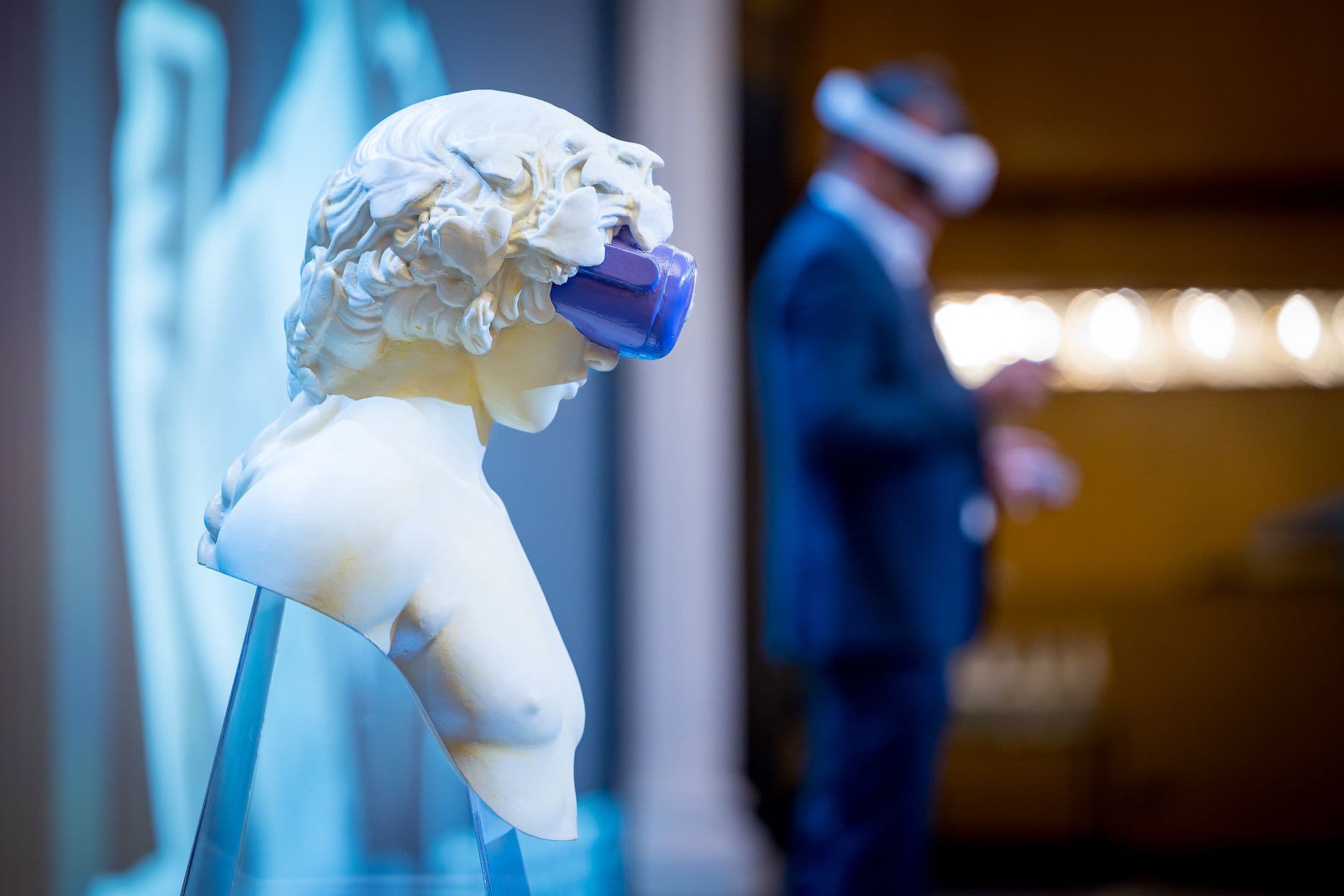 Dionysus statue wearing purple VR headset