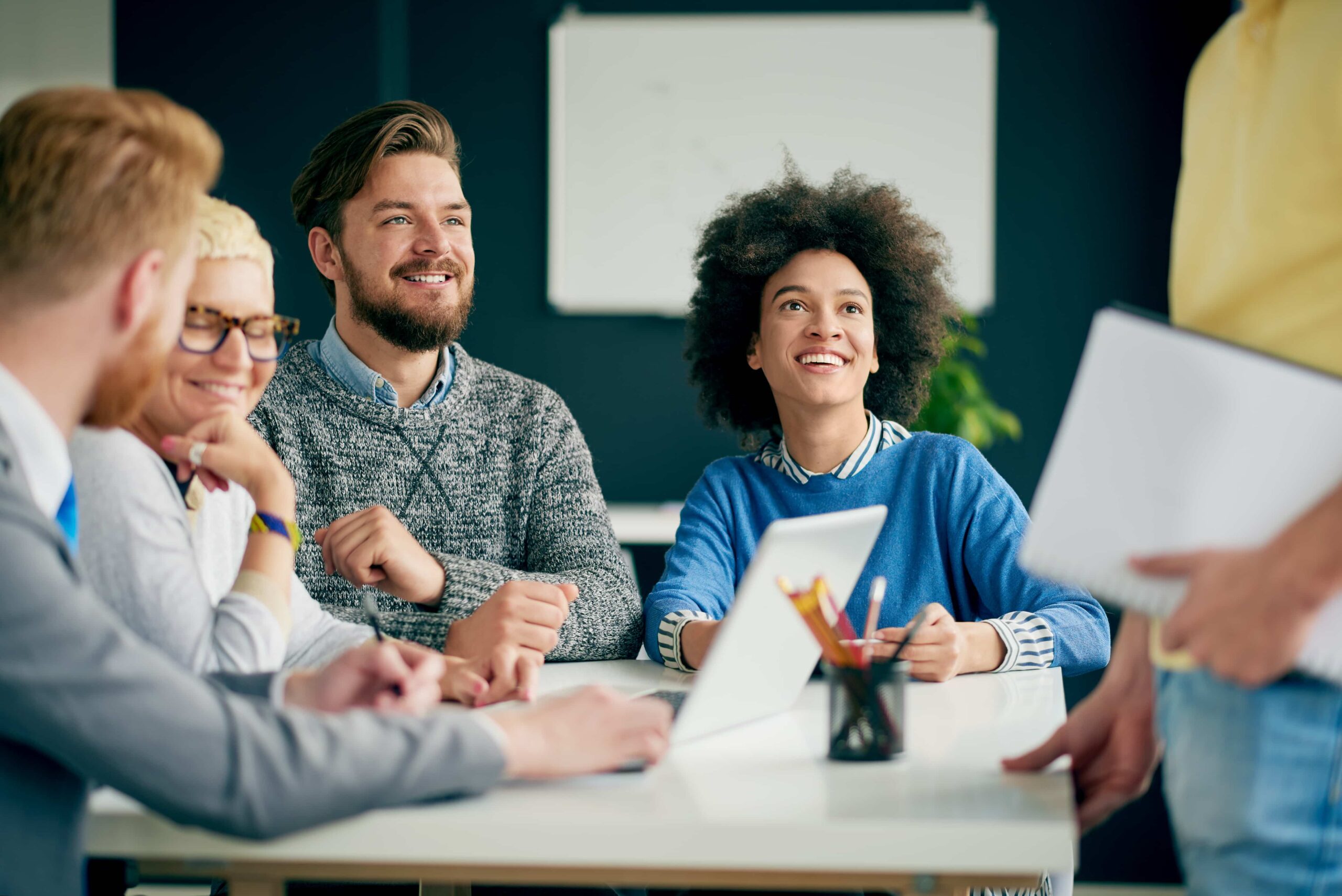 Team of young professionals discussing in an office